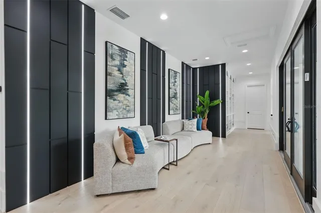 a bedroom with bed and a large window