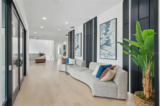 a bathroom with a sink a toilet a mirror and shower