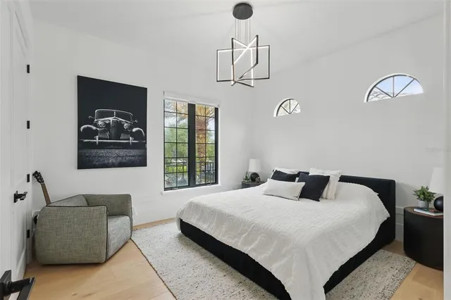an aerial view of a house with a yard basket ball court and outdoor seating