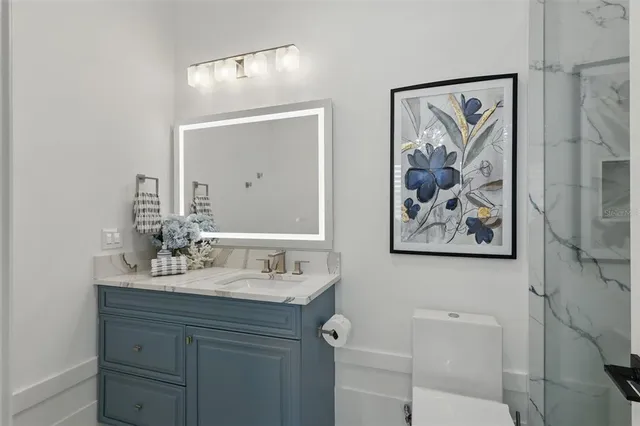 an aerial view of a house with garden space and outdoor seating