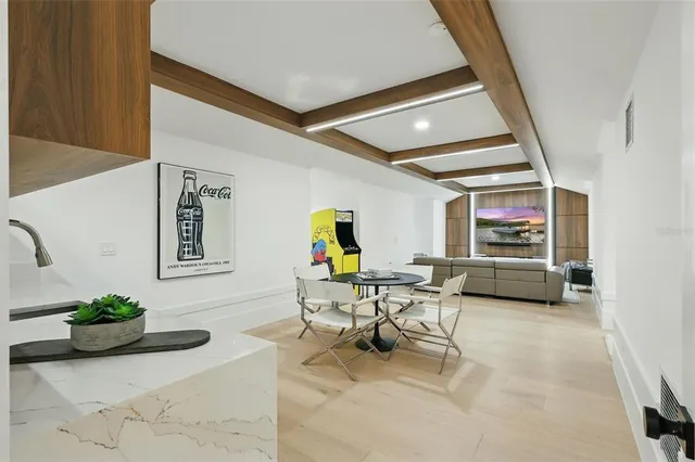 an aerial view of residential houses with outdoor space and ocean view