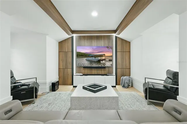 an aerial view of a houses with a lake view