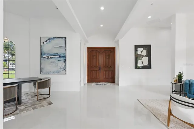 a view of a dining room with furniture and window