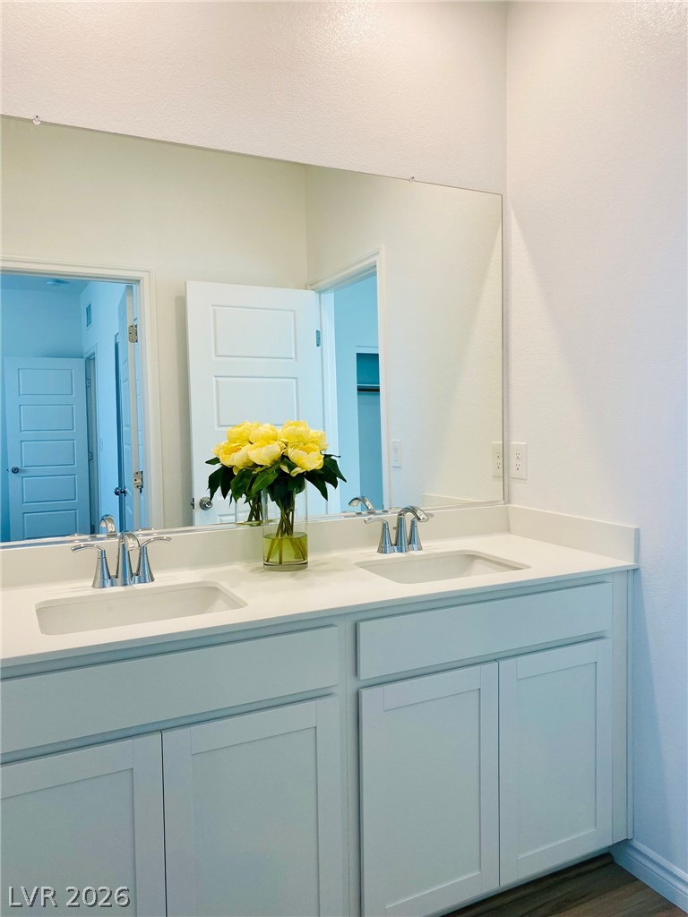 4457 Sawyer Ridge Street Las Vegas, NV 89147 - Photo 22 of 32 This spacious bathroom offers dual vanities with ample counter space.