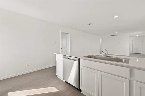 a kitchen with a sink and cabinets
