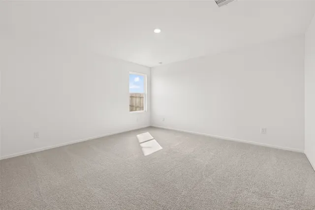 an empty room with a natural light