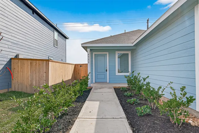 a view of a backyard with potted plants