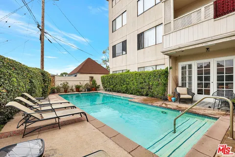 a view of a backyard with sitting area