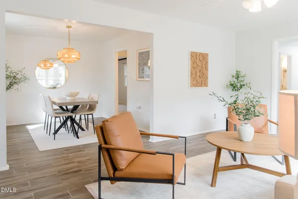 a view of a hallway with wooden floor and windows