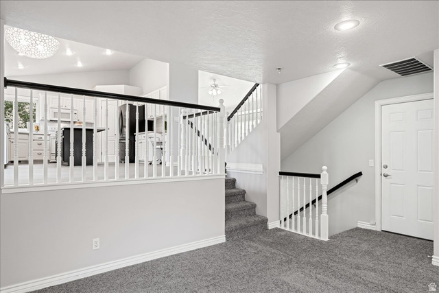 7 Reflection Way St. George, UT 84770 - Photo 20 of 54 Stairway featuring a textured ceiling, carpet flooring, recessed lighting, and ceiling fan