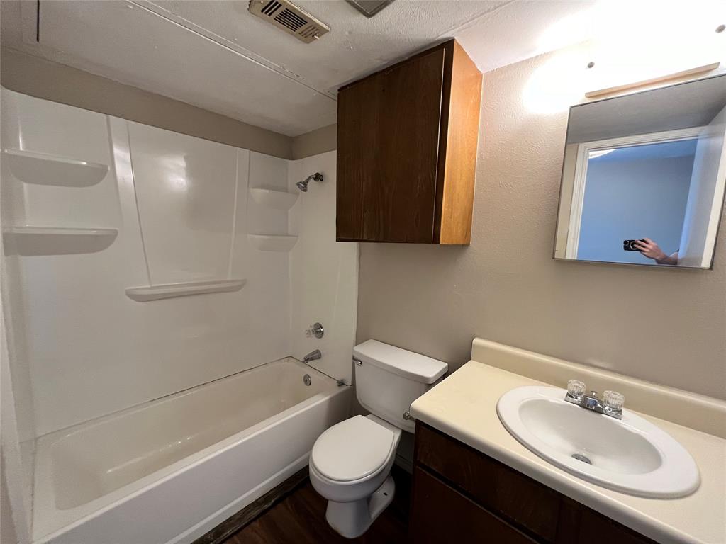 2526 West Prairie Street, Unit 108 Denton, TX 76201 - Photo 7 of 12 This bathroom has a shower/tub combination. Notice the extra cabinet space over the toilet.