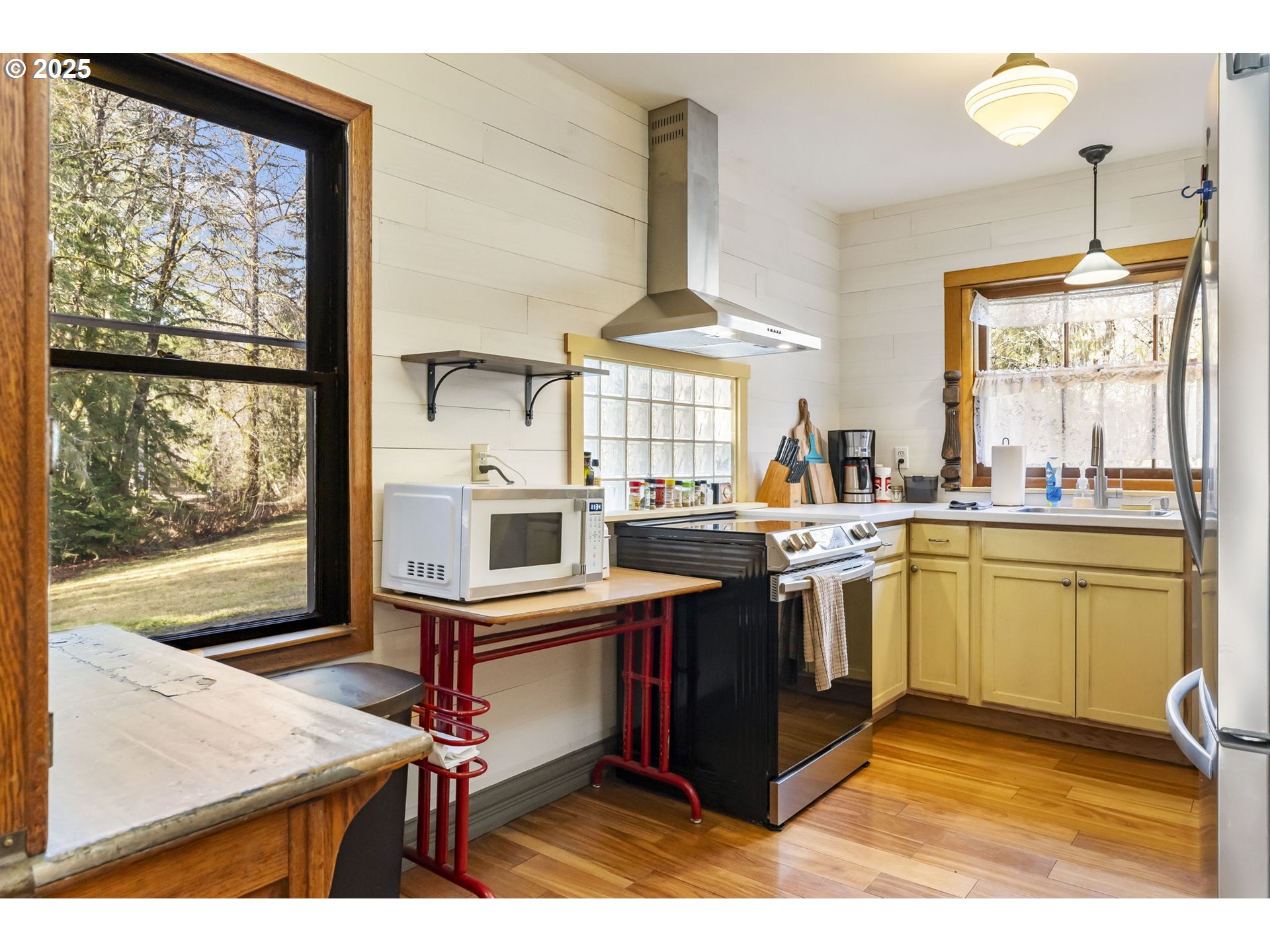 162 Riverside Drive Idanha, OR 97350 - Photo 12 of 40 a kitchen with stainless steel appliances kitchen island granite countertop a stove and a sink