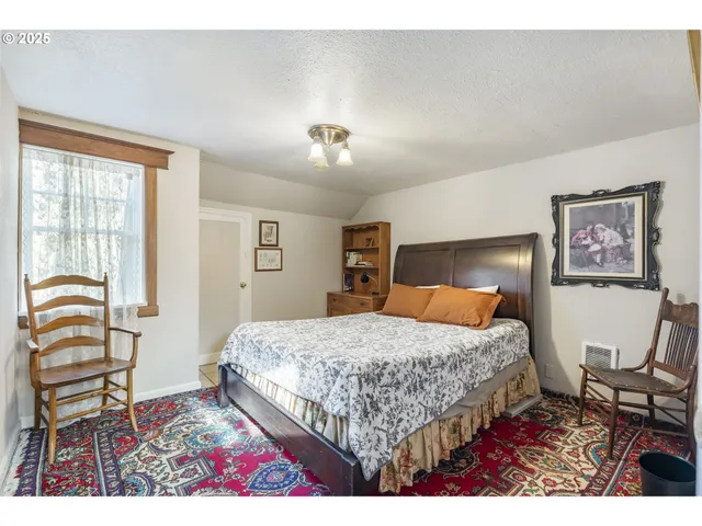 a bedroom with a bed and furniture