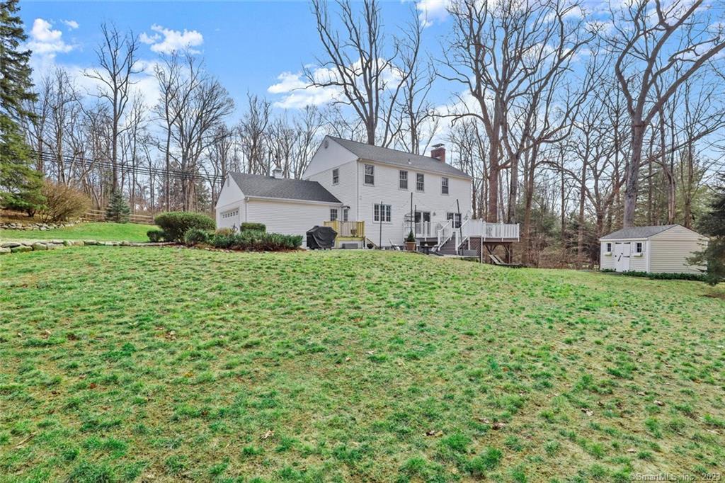183 Frogtown Road New Canaan, CT 06840 - Photo 26 of 37 a view of a house with a yard
