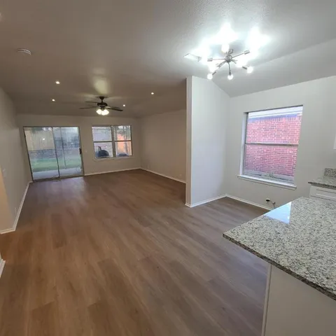 a view of an empty room and window