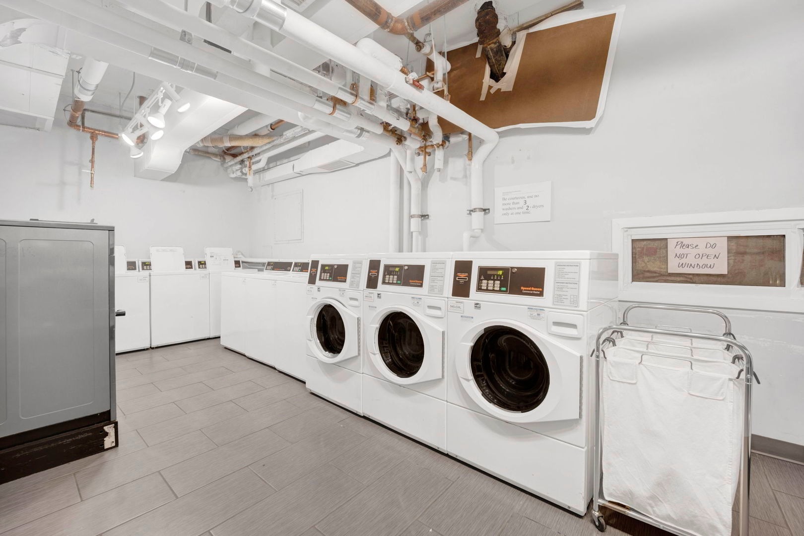 1550 North Lake Shore Drive, Unit 3C Chicago, IL 60610 - Photo 11 of 16 a utility room with dryer and washer
