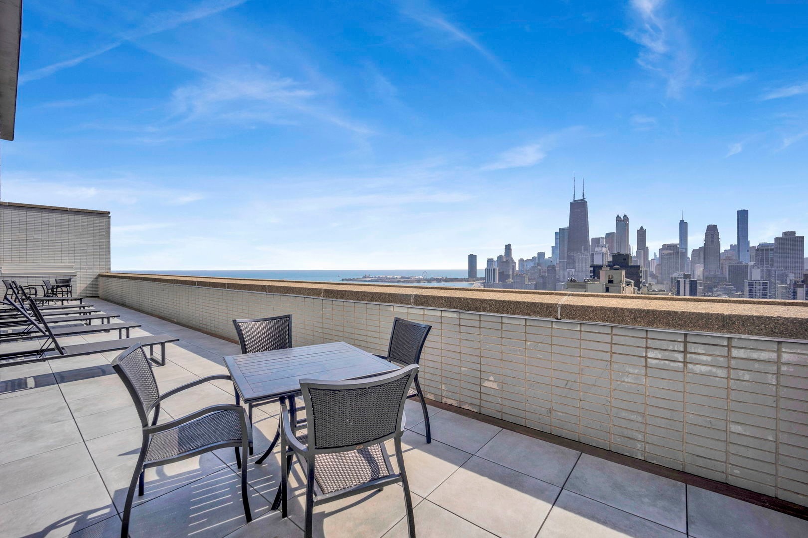 1550 North Lake Shore Drive, Unit 3C Chicago, IL 60610 - Photo 13 of 16 a view of a chairs and table on the terrace