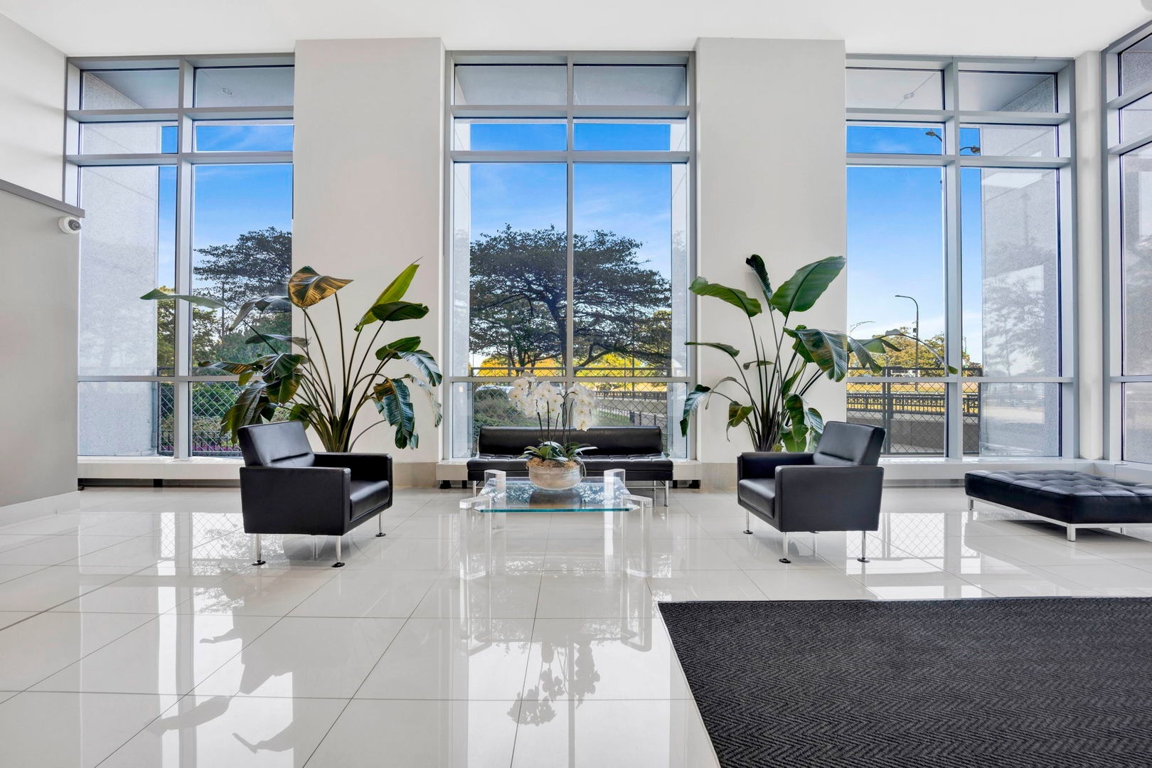 1550 North Lake Shore Drive, Unit 3C Chicago, IL 60610 - Photo 14 of 16 a living room with furniture potted plant and a large window