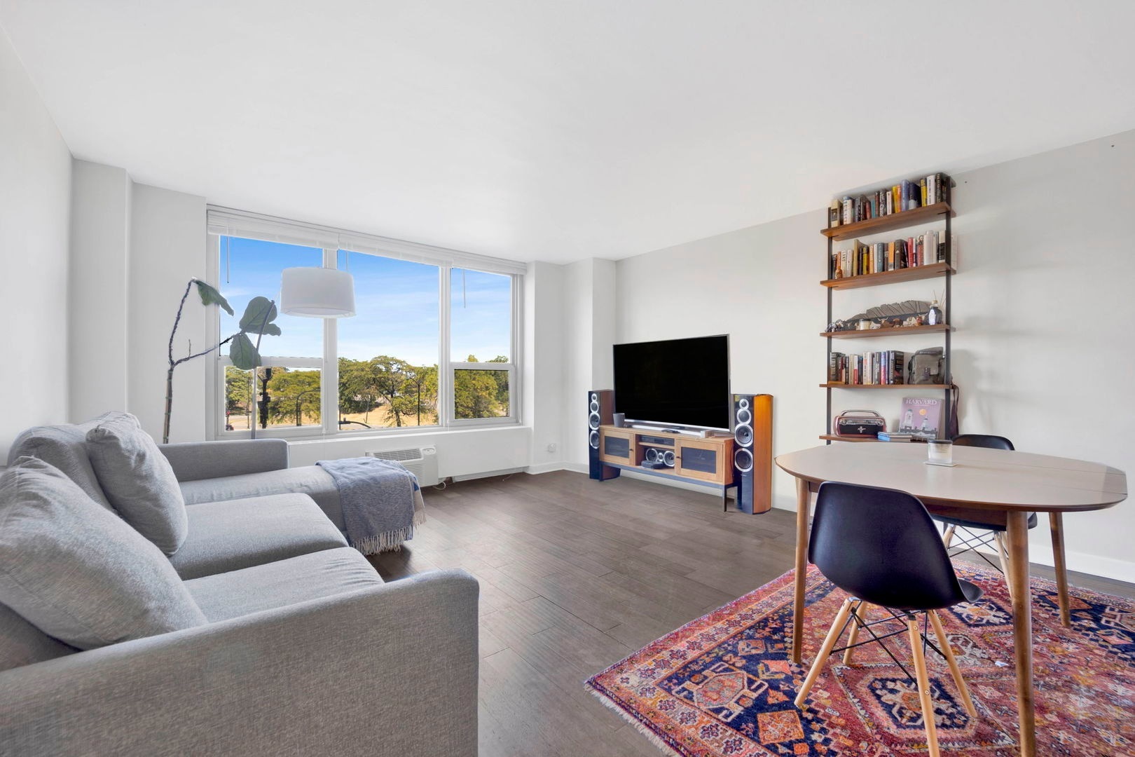 1550 North Lake Shore Drive, Unit 3C Chicago, IL 60610 - Photo 4 of 16 a living room with furniture and a flat screen tv