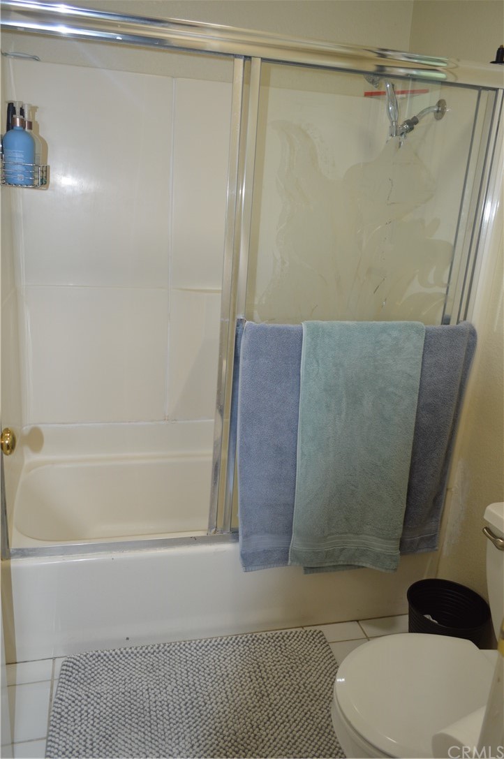 5577 Pioneer Boulevard, Unit 9 Whittier, CA 90601 - Photo 24 of 45 a bathroom with a shower and a toilet