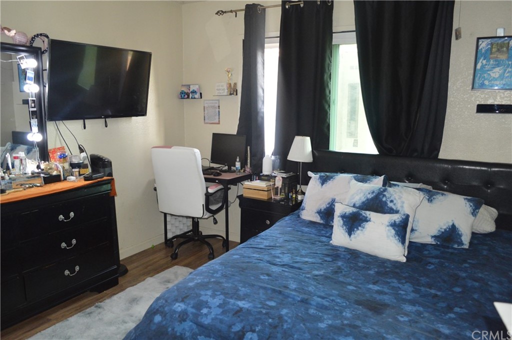 5577 Pioneer Boulevard, Unit 9 Whittier, CA 90601 - Photo 27 of 45 a living room with furniture and a flat screen tv