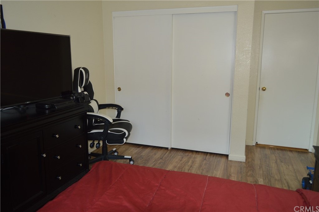 5577 Pioneer Boulevard, Unit 9 Whittier, CA 90601 - Photo 29 of 45 a view of workspace with wooden floor and mirror