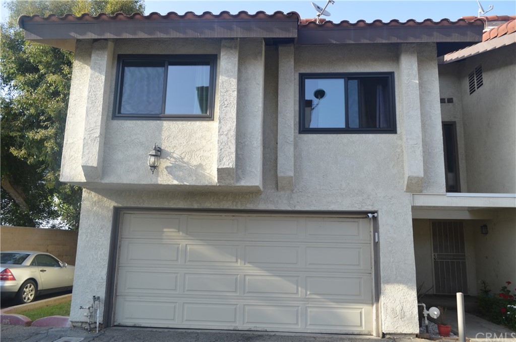 5577 Pioneer Boulevard, Unit 9 Whittier, CA 90601 - Photo 3 of 45 a house view with a outdoor space