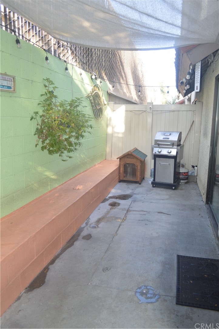 5577 Pioneer Boulevard, Unit 9 Whittier, CA 90601 - Photo 35 of 45 a bedroom with a bed and a window