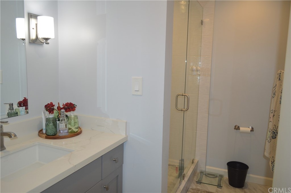 5577 Pioneer Boulevard, Unit 9 Whittier, CA 90601 - Photo 41 of 45 a bathroom with a sink and vanity
