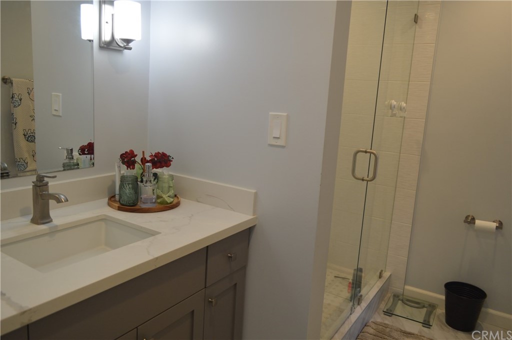 5577 Pioneer Boulevard, Unit 9 Whittier, CA 90601 - Photo 44 of 45 a bathroom with a sink and a mirror