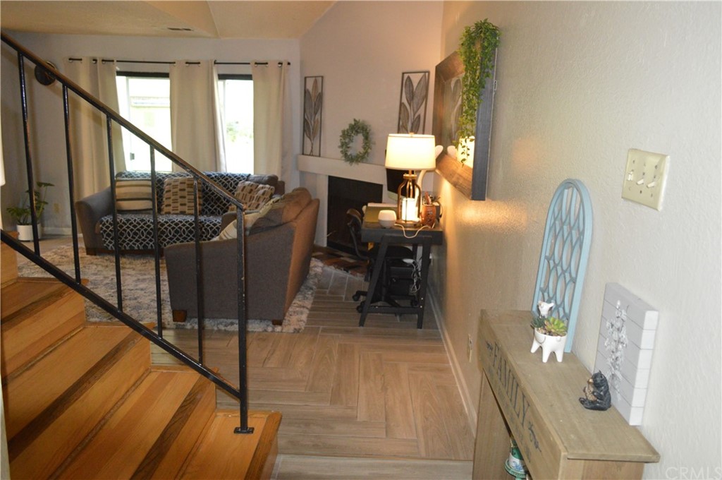 5577 Pioneer Boulevard, Unit 9 Whittier, CA 90601 - Photo 6 of 45 a living room with furniture a mirror and a dining table