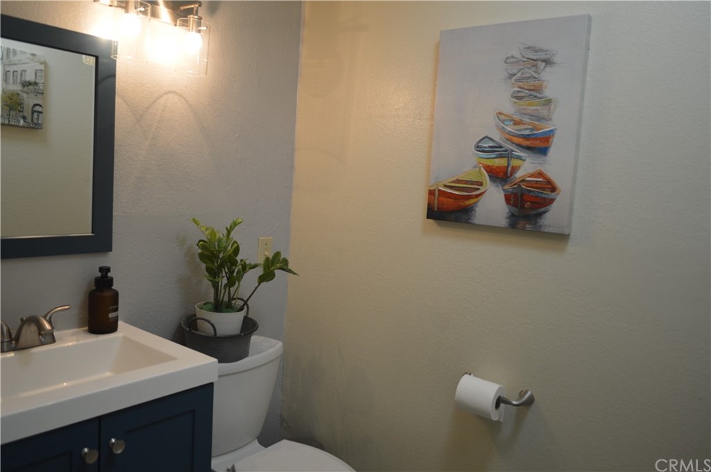 5577 Pioneer Boulevard, Unit 9 Whittier, CA 90601 - Photo 10 of 45 a bathroom with a sink a toilet and vanity