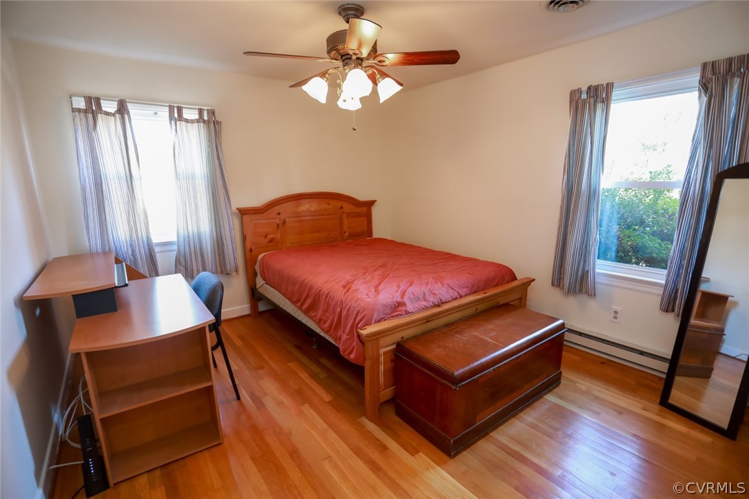 3350 Clintwood Road Midlothian, VA 23112 - Photo 11 of 18 a bedroom with a bed and a chandelier