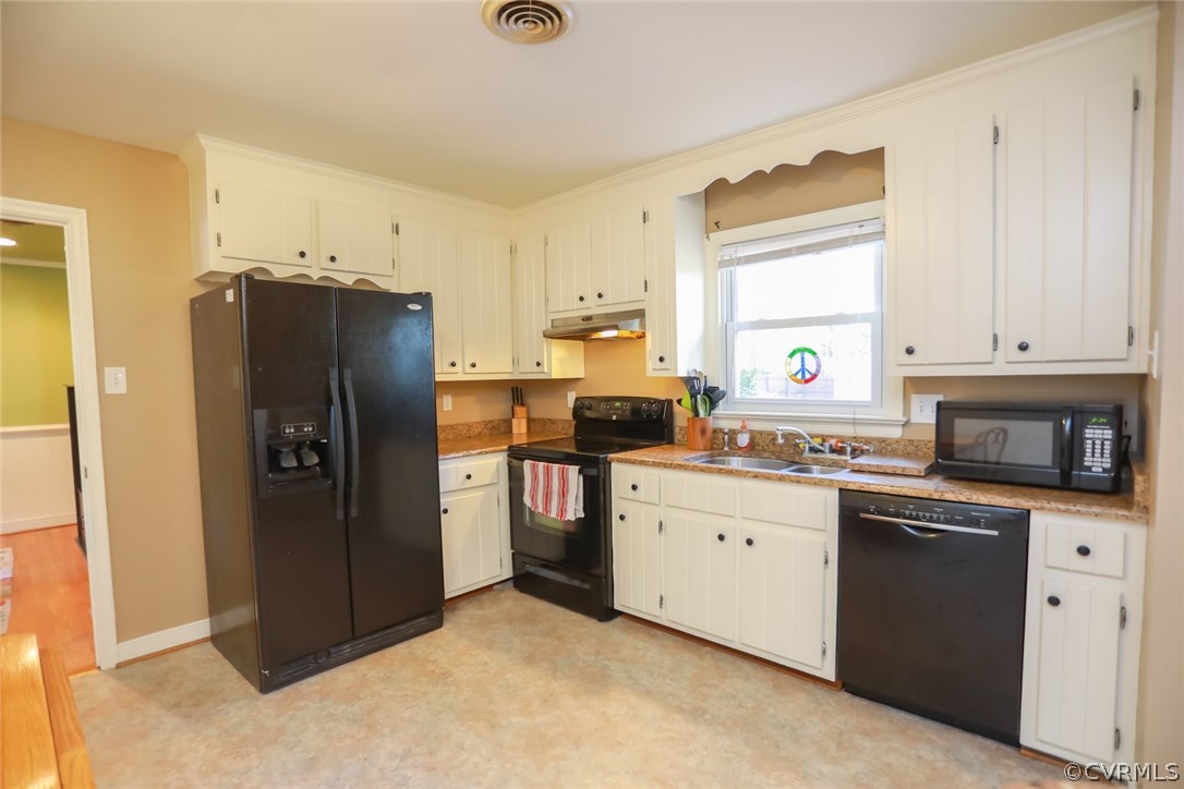 3350 Clintwood Road Midlothian, VA 23112 - Photo 5 of 18 a kitchen with stainless steel appliances a refrigerator sink and cabinets