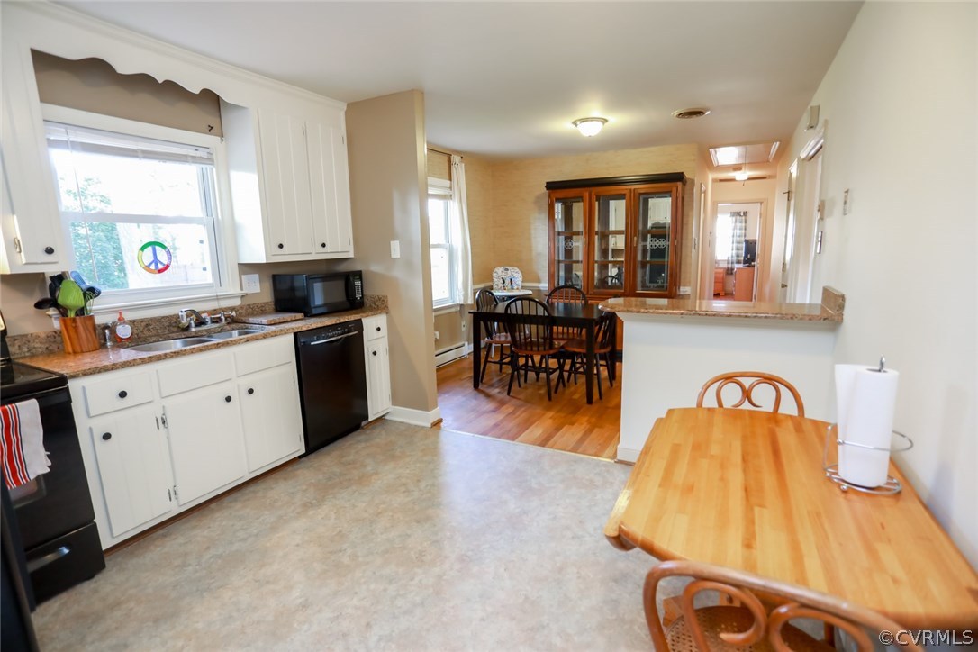3350 Clintwood Road Midlothian, VA 23112 - Photo 6 of 18 a kitchen with a sink appliances and cabinets