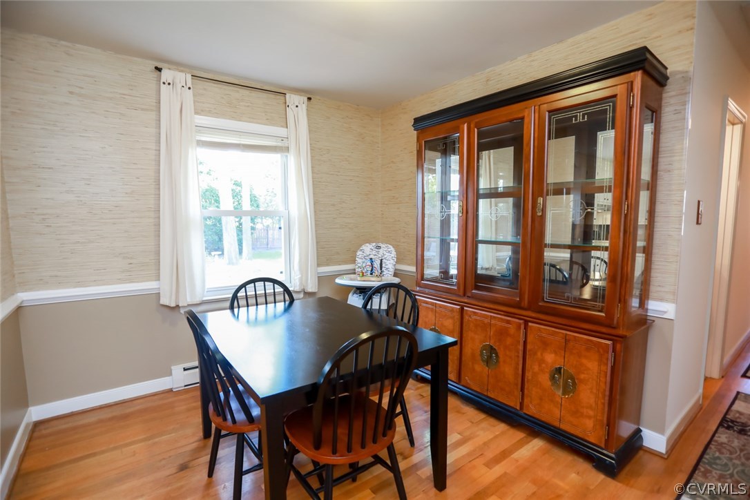 3350 Clintwood Road Midlothian, VA 23112 - Photo 7 of 18 a view of a dining room with furniture window and wooden floor
