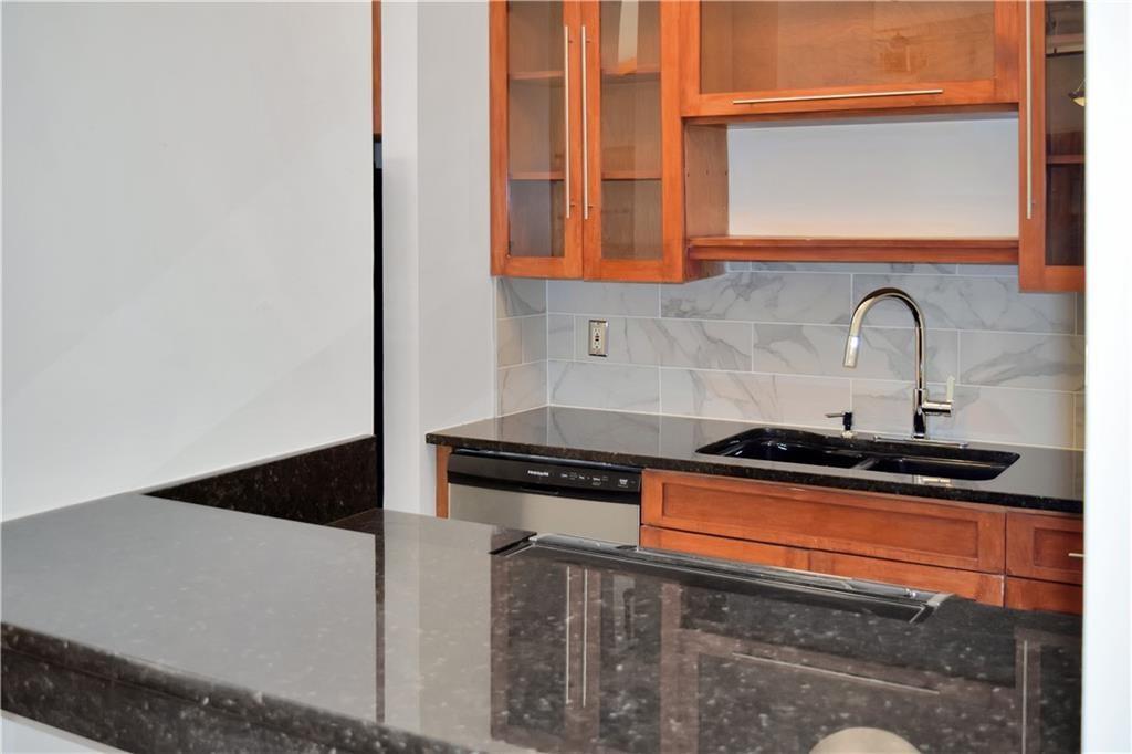 120 Ralph McGill Boulevard Northeast, Unit 402 Atlanta, GA 30308 - Photo 15 of 38 a kitchen with a stove and a microwave