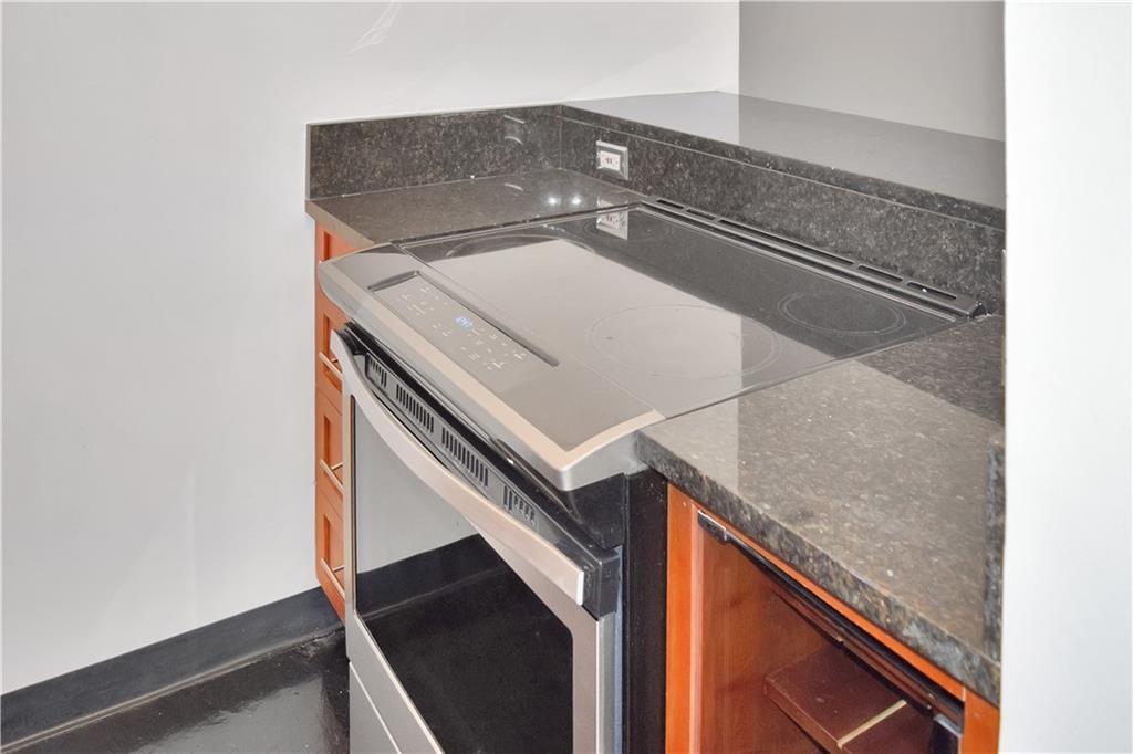 120 Ralph McGill Boulevard Northeast, Unit 402 Atlanta, GA 30308 - Photo 17 of 38 a utility room with a sink and washing machine