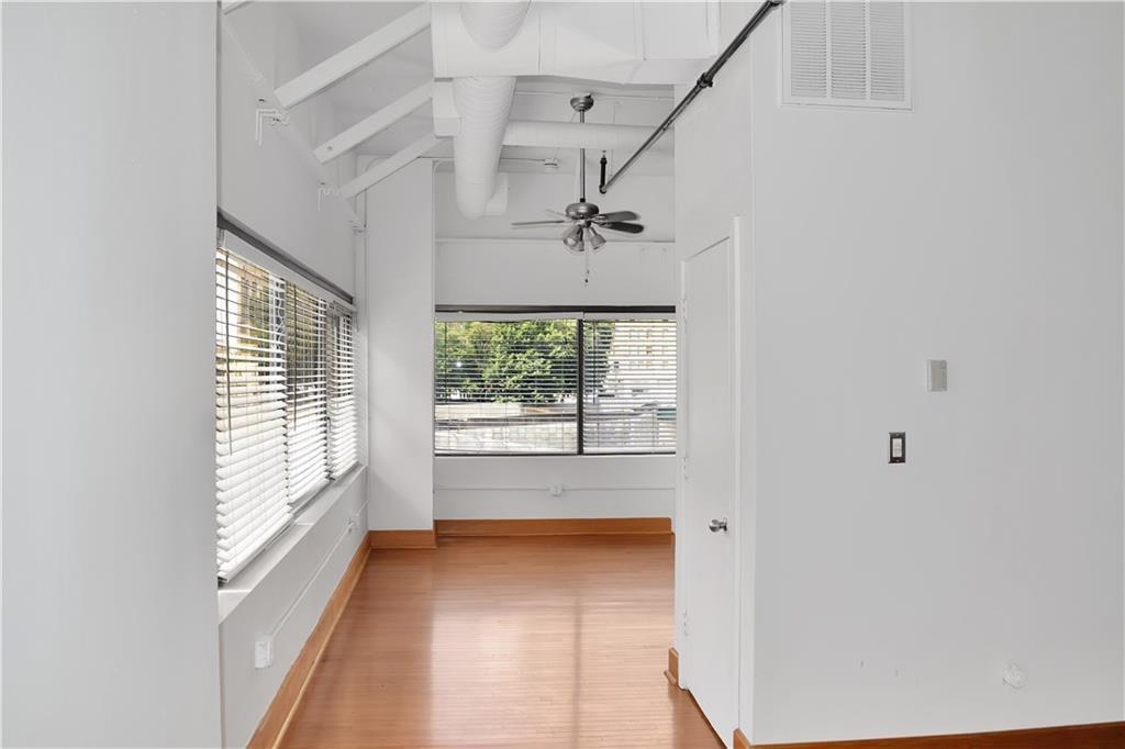120 Ralph McGill Boulevard Northeast, Unit 402 Atlanta, GA 30308 - Photo 18 of 38 a view of hallway with windows