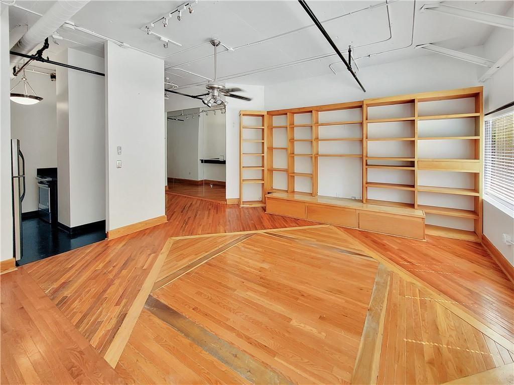120 Ralph McGill Boulevard Northeast, Unit 402 Atlanta, GA 30308 - Photo 2 of 38 a view of an empty room with a window
