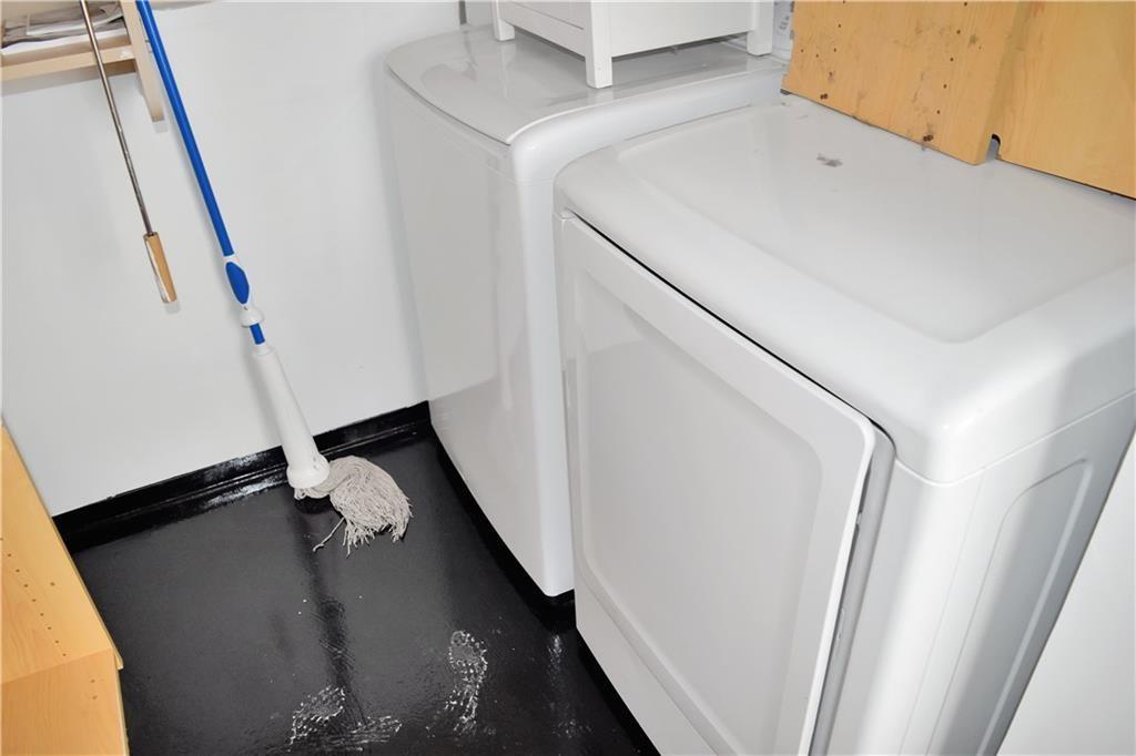 120 Ralph McGill Boulevard Northeast, Unit 402 Atlanta, GA 30308 - Photo 25 of 38 a utility room with dryer and washer