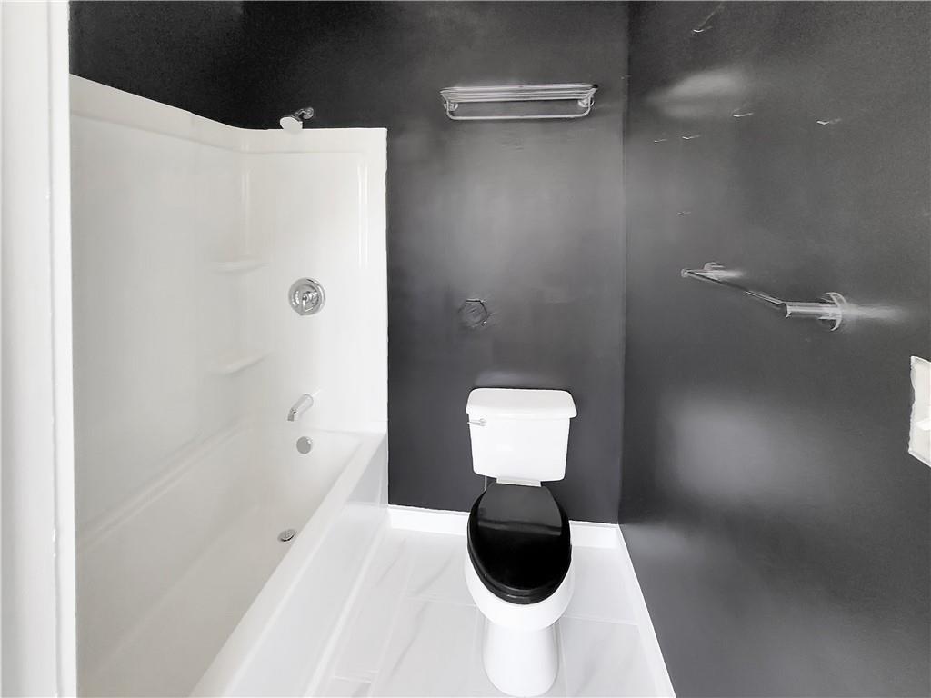 120 Ralph McGill Boulevard Northeast, Unit 402 Atlanta, GA 30308 - Photo 27 of 38 a bathroom with a shower and toilet