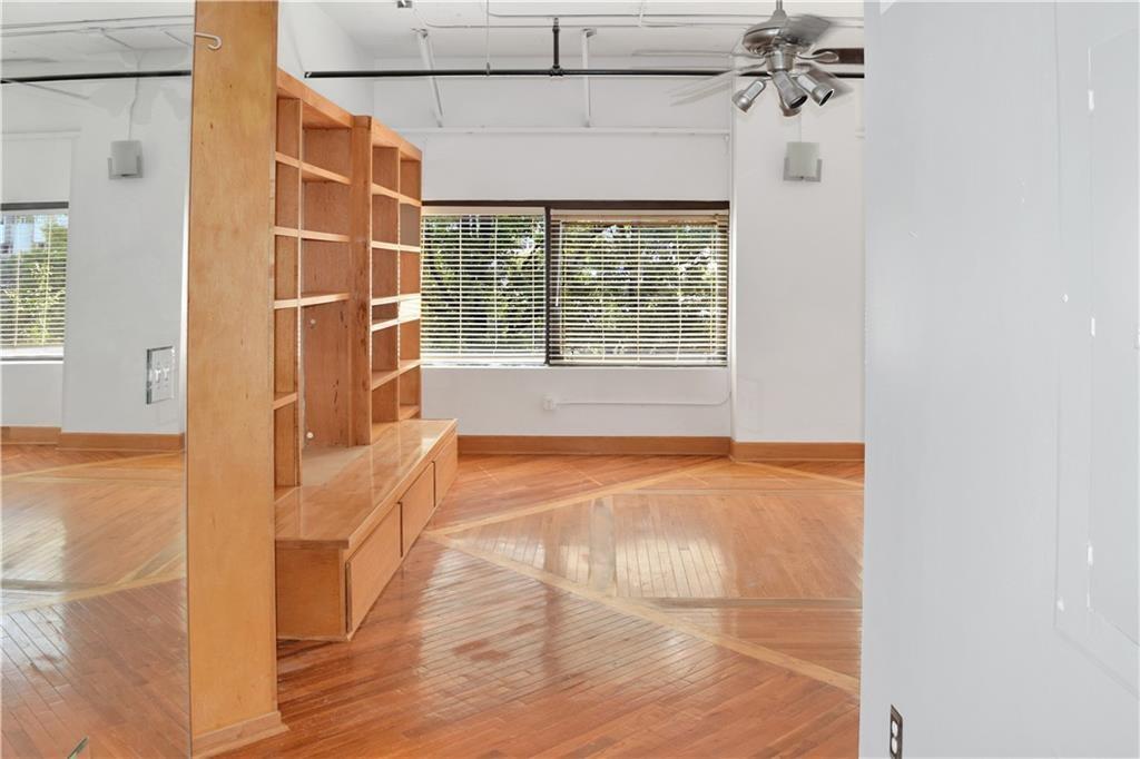 120 Ralph McGill Boulevard Northeast, Unit 402 Atlanta, GA 30308 - Photo 3 of 38 a view of an empty room with a window