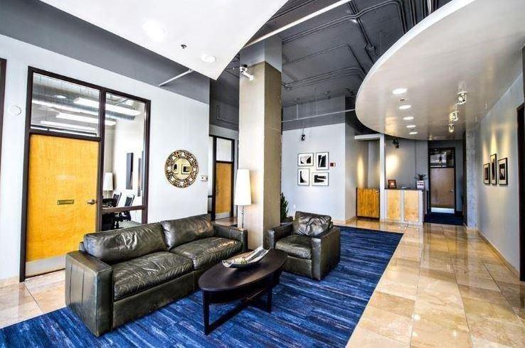 120 Ralph McGill Boulevard Northeast, Unit 402 Atlanta, GA 30308 - Photo 33 of 38 a living room with furniture and a large window