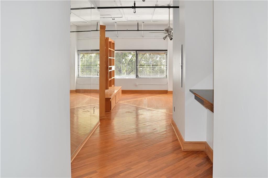 120 Ralph McGill Boulevard Northeast, Unit 402 Atlanta, GA 30308 - Photo 9 of 38 a view of hallway with wooden floor