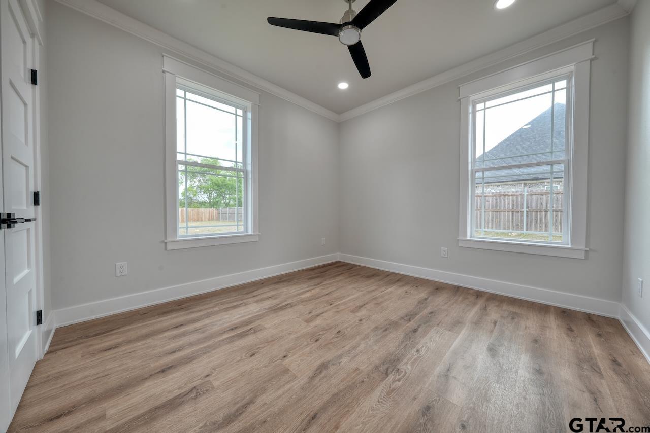 19383 Ridge Point Circle Lindale, TX 75771 - Photo 37 of 48 a view of an empty room with wooden floor and a window
