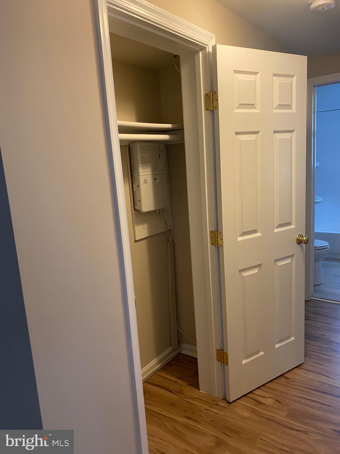 1805 Key Boulevard, Unit 511 Arlington, VA 22201 - Photo 14 of 26 a view of storage and utility room with wooden floor