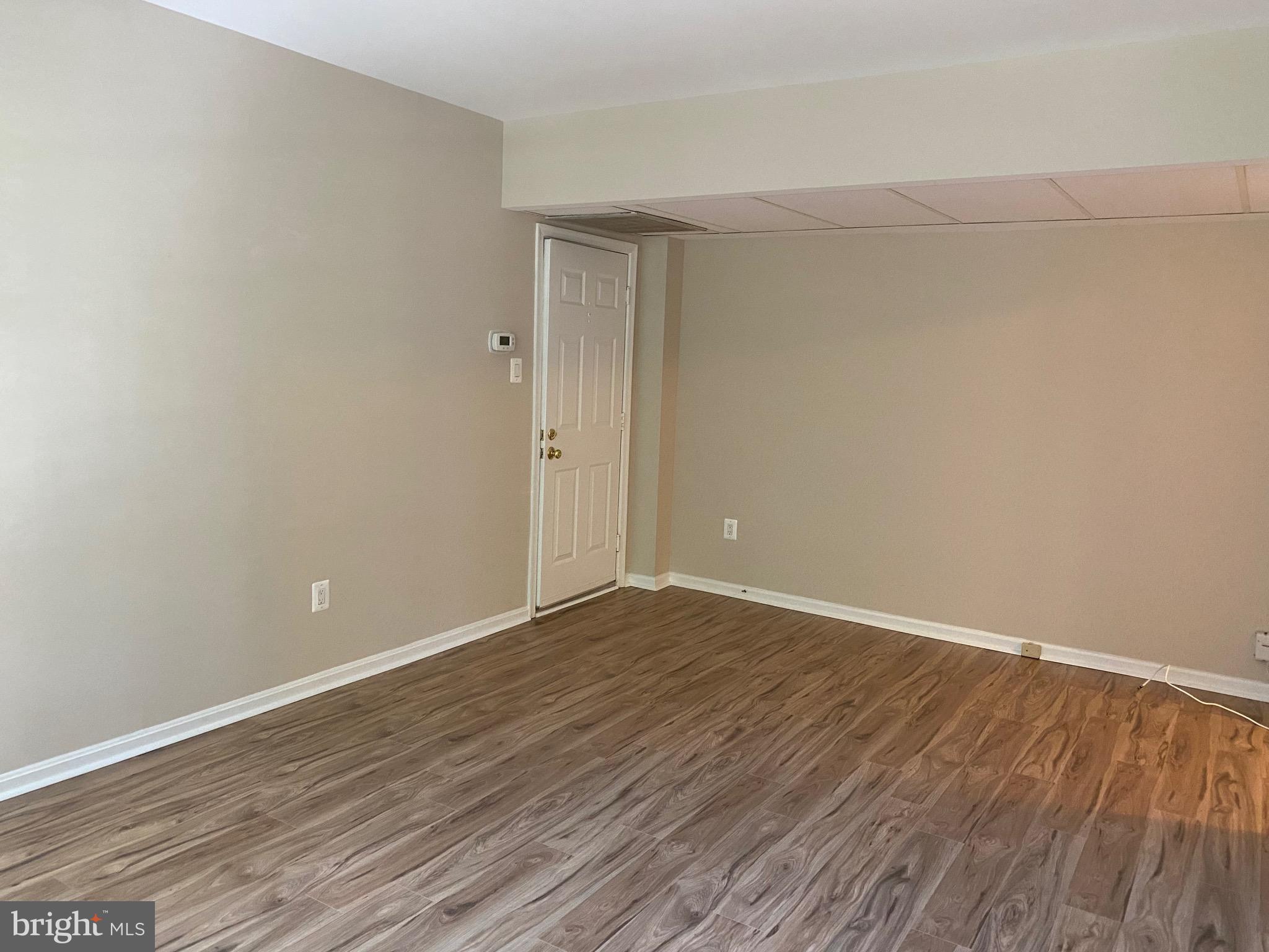 1805 Key Boulevard, Unit 511 Arlington, VA 22201 - Photo 4 of 26 a view of an empty room with wooden floor