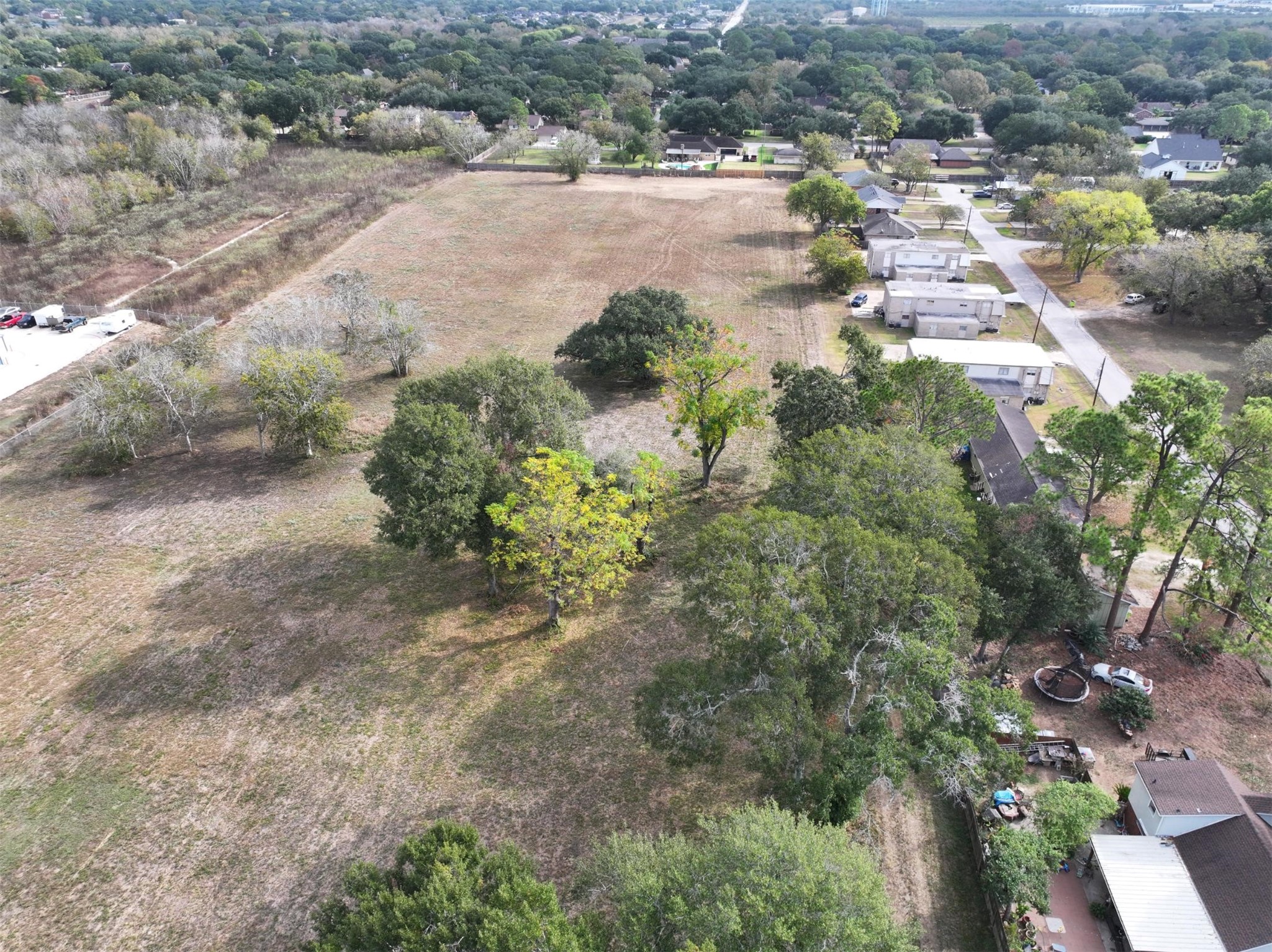 2417 4th Street Rosenberg, TX 77471 - Photo 15 of 50 a view of a yard with yellow plants