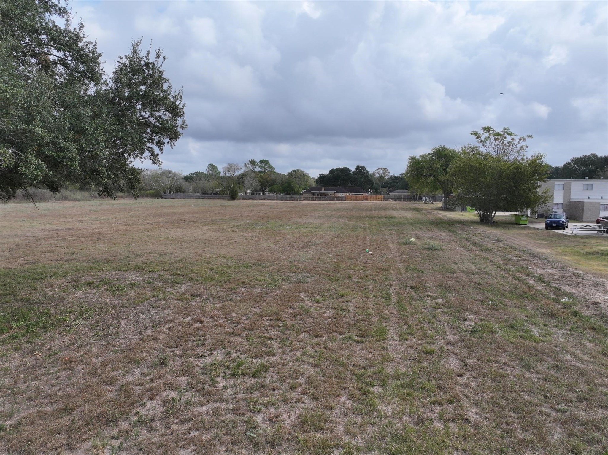 2417 4th Street Rosenberg, TX 77471 - Photo 24 of 50 a view of dirt field with trees